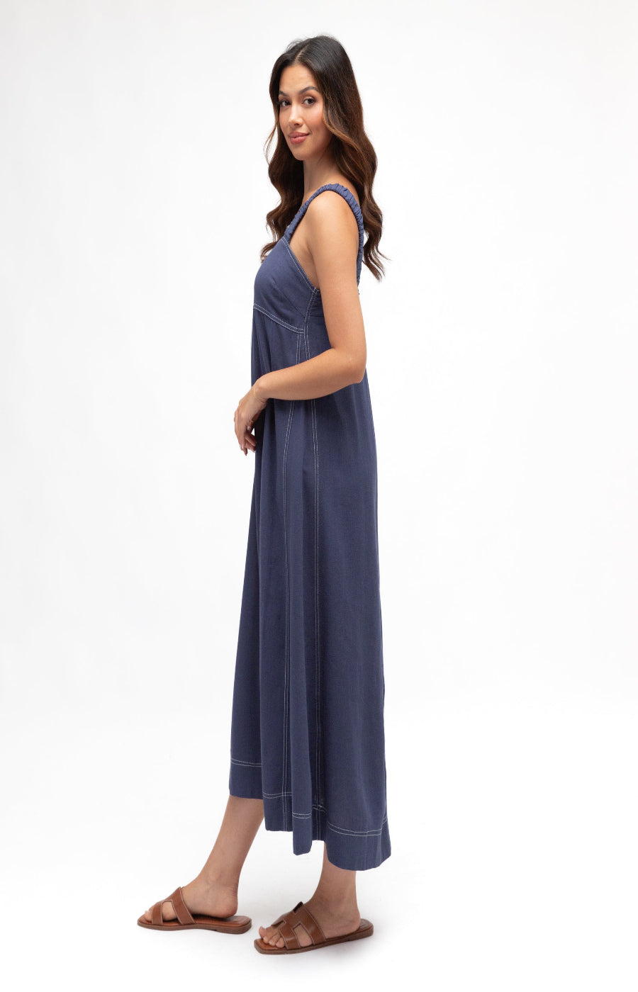 Woman wearing a blue dress on a white background