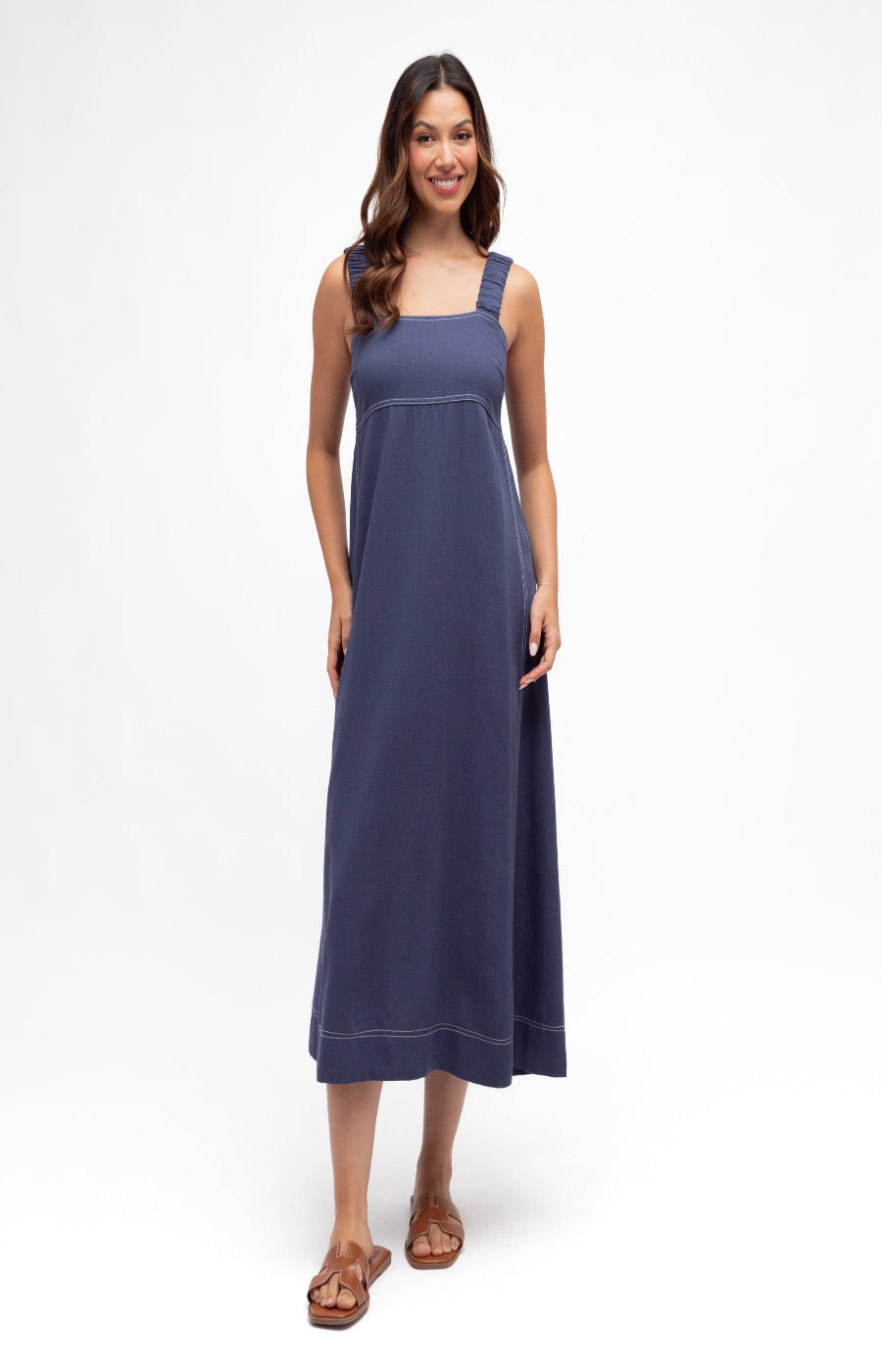 Woman wearing a blue dress on a white background